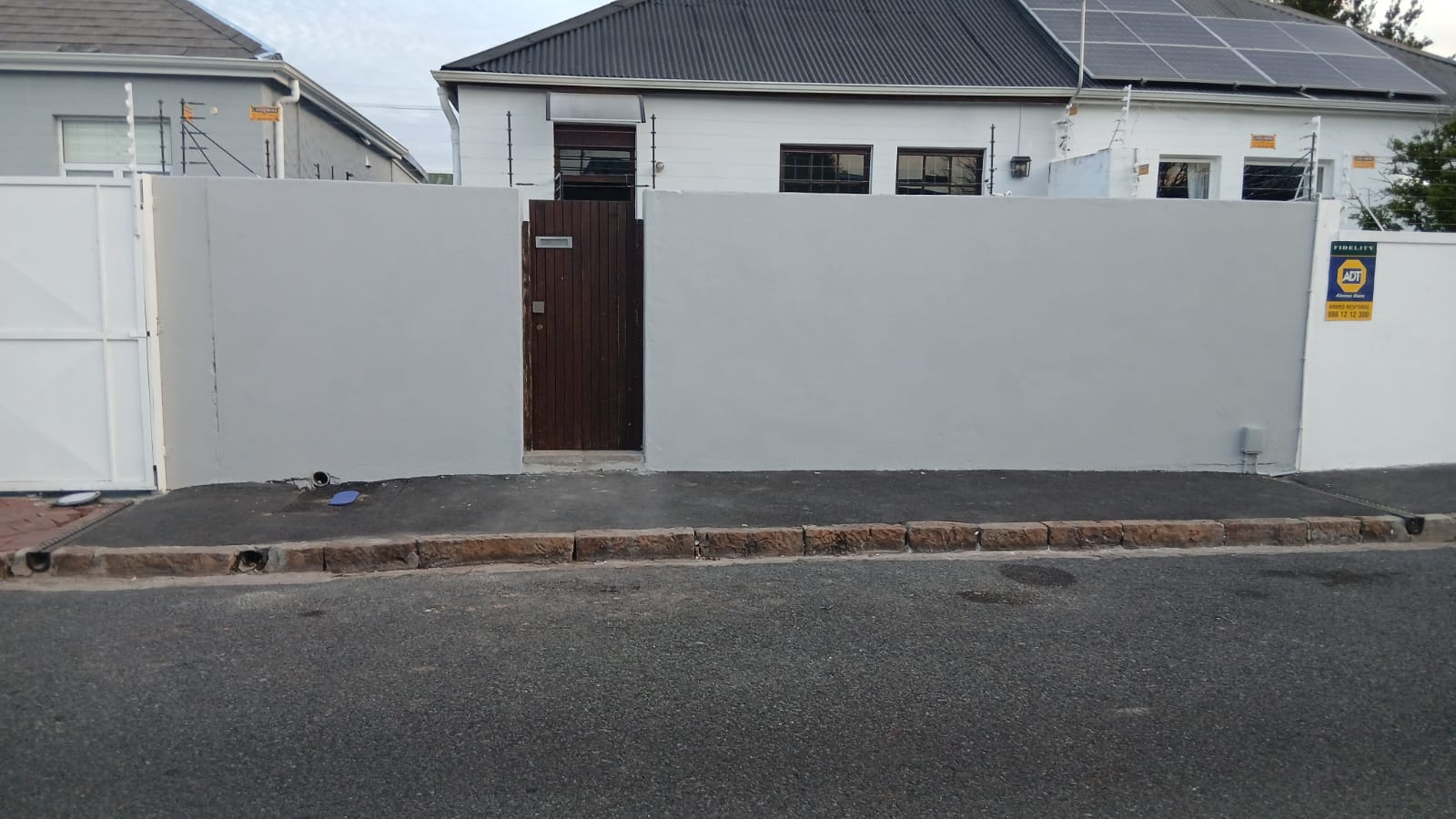 Boundary wall after repainting — clean fresh finish